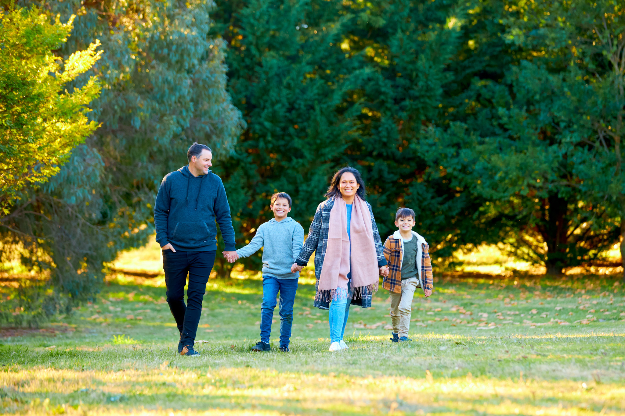 Photograph of family walking holding hands in Canberra